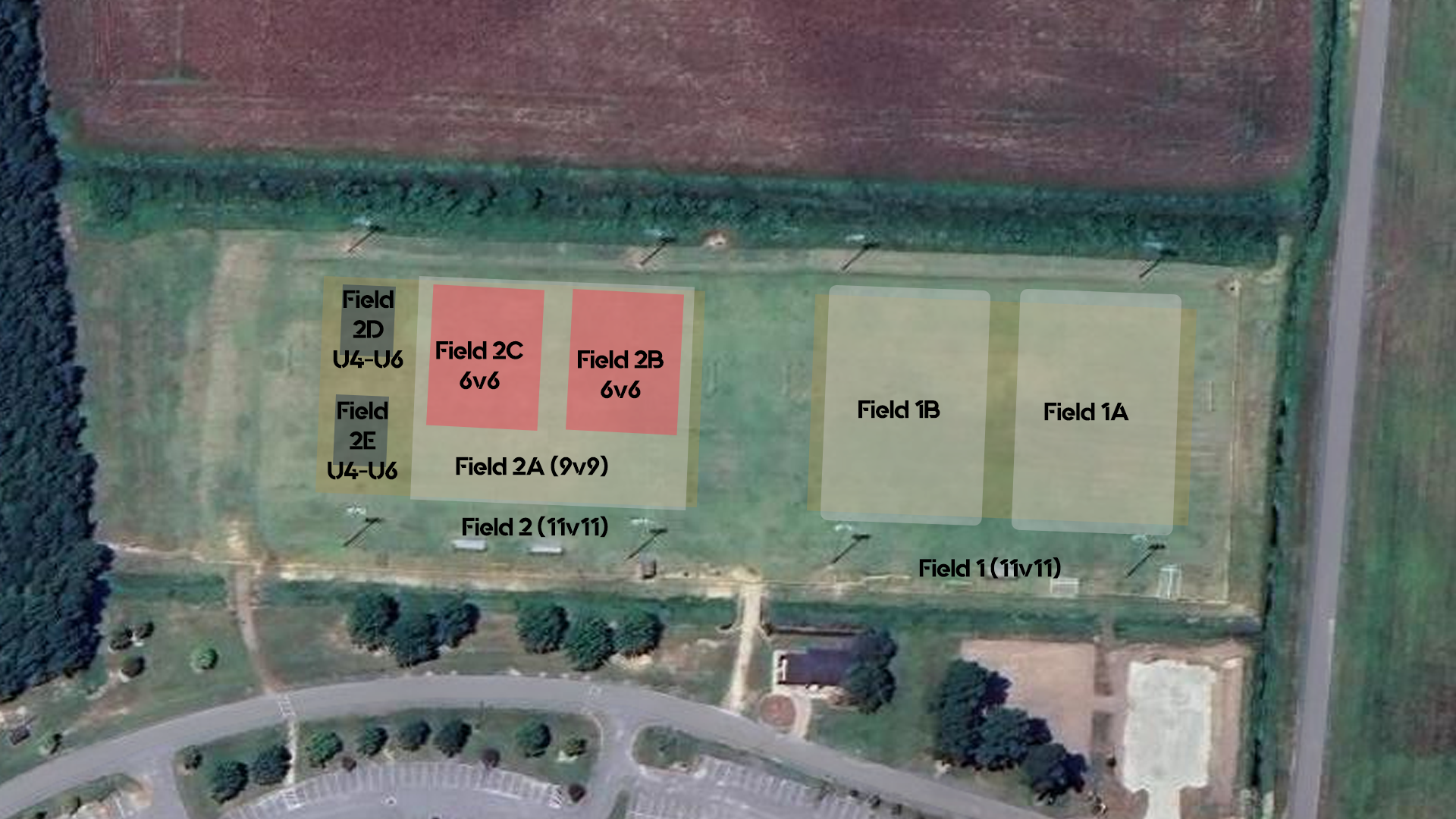 An aerial view of a field with a lot of fields and trees.