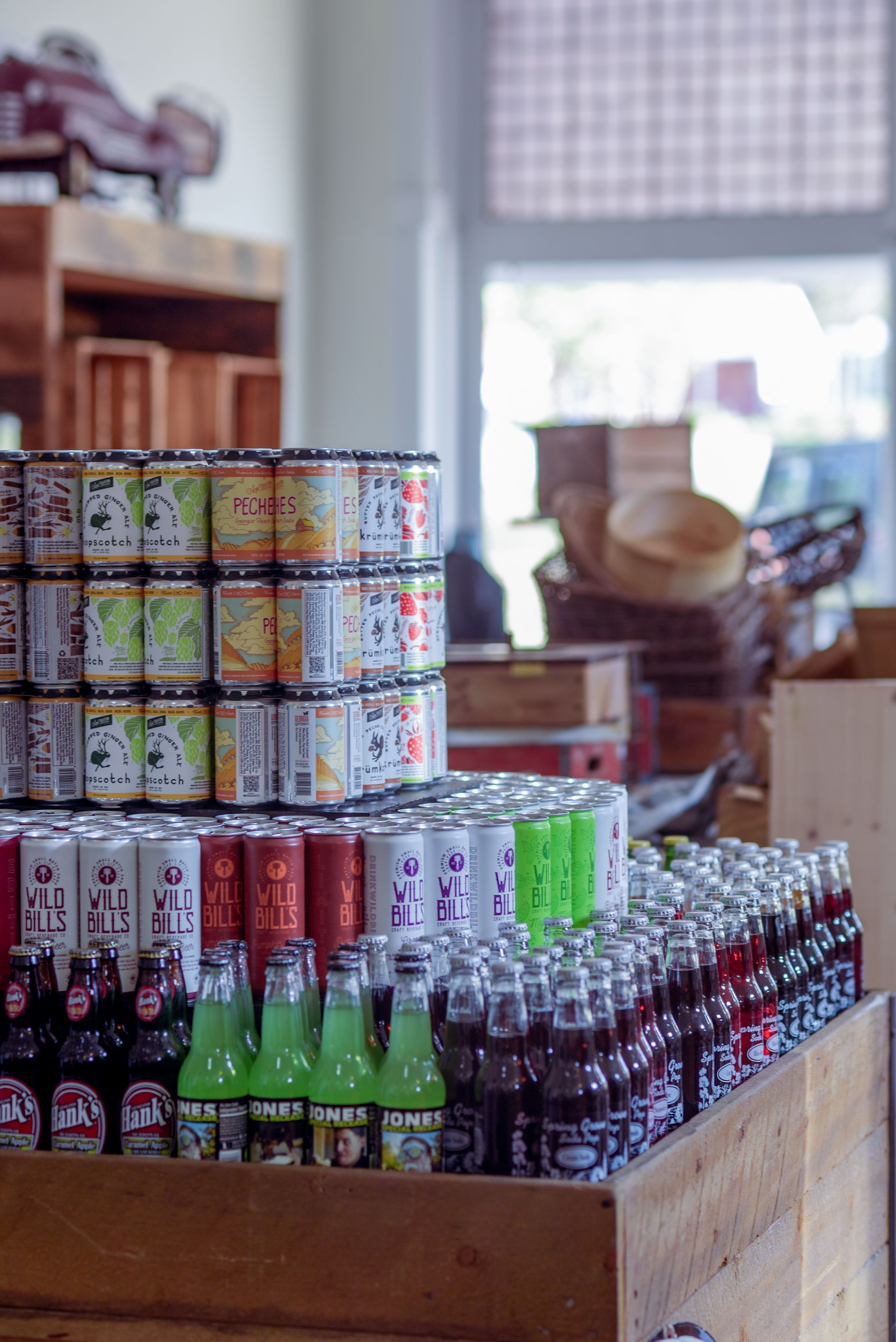 A display of cans and bottles of soda in a store.