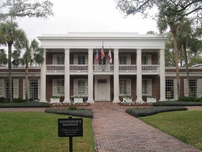 A large house with a sign that says governor 's mansion