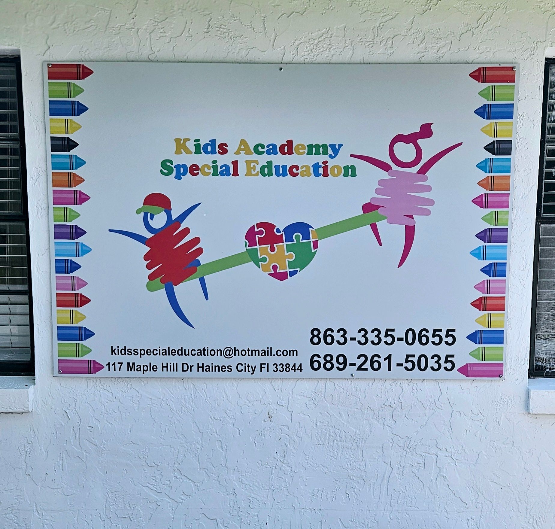 A sign that says kids academy special education on it