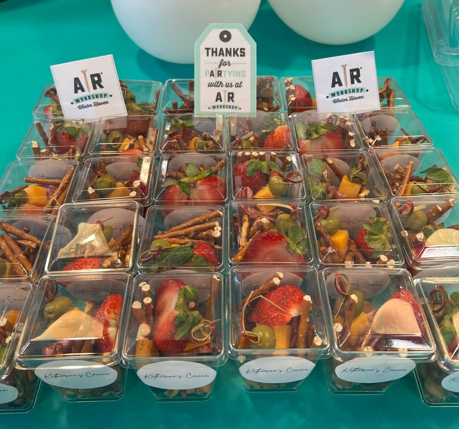 A display of food with a thank you tag that says 