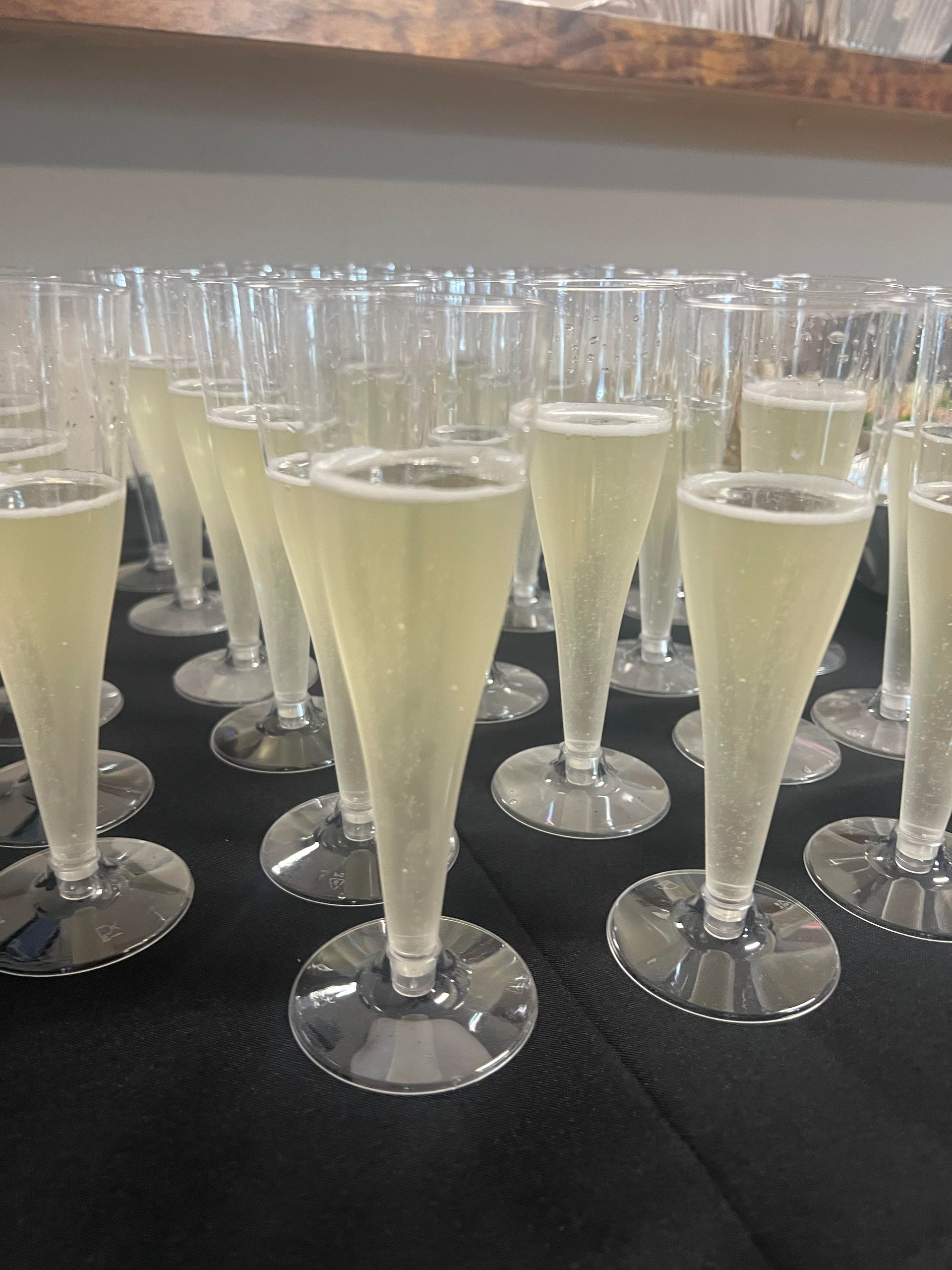 A bunch of champagne glasses are sitting on a table.