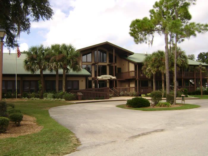 A large building with palm trees in front of it