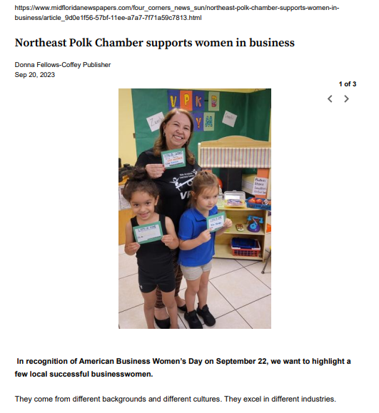 A woman and two children are standing next to each other holding cards.