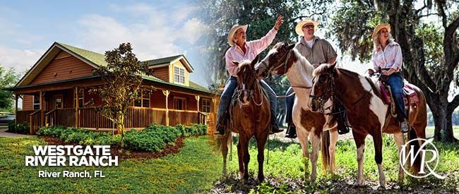 A couple of people riding horses in front of a house.