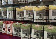 A row of boxes sitting on top of each other on a shelf in a store