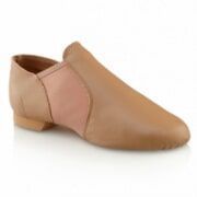 A pair of tan leather jazz shoes on a white background.