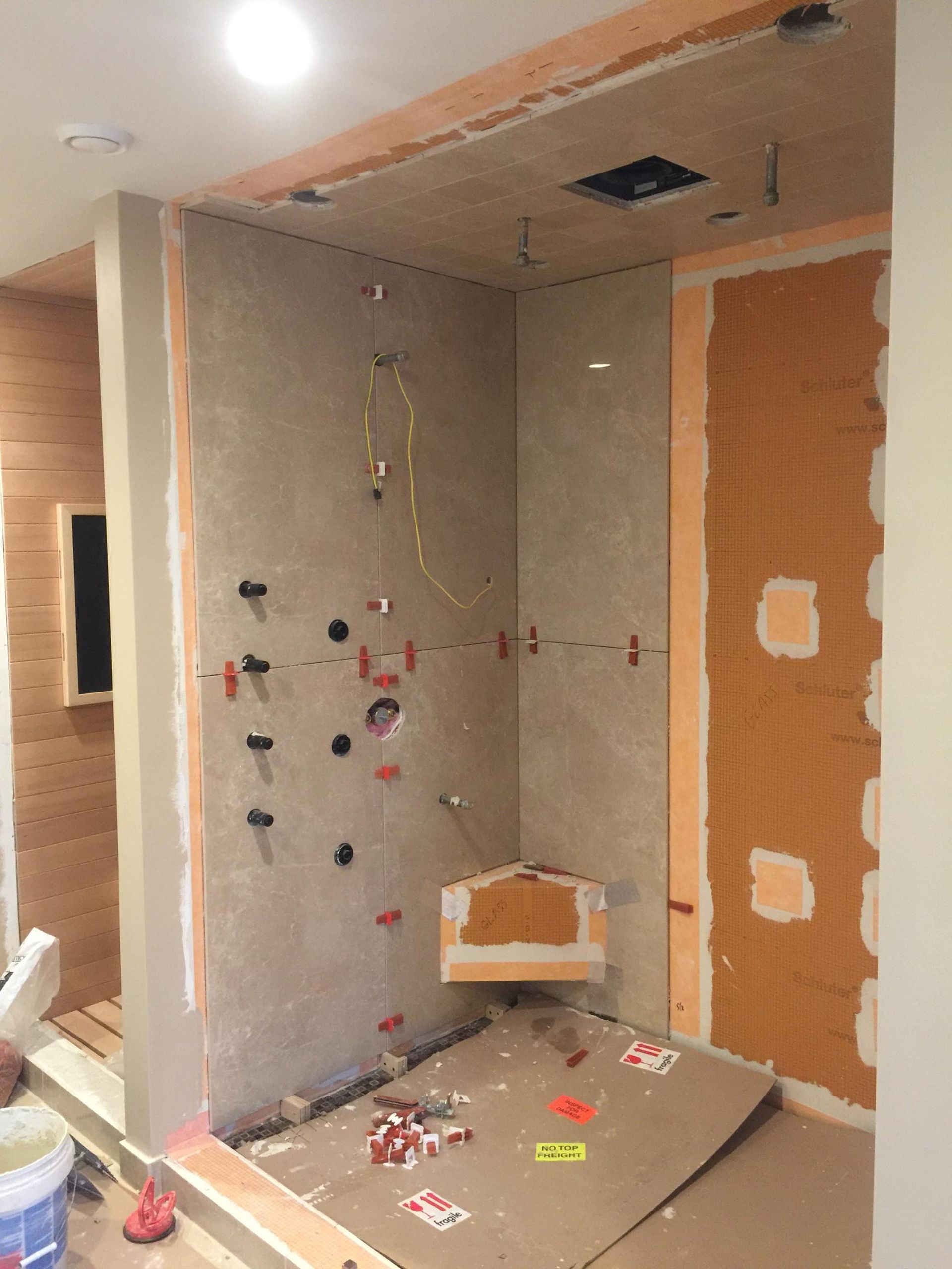 A room that is being remodeled with a lot of tools on the floor