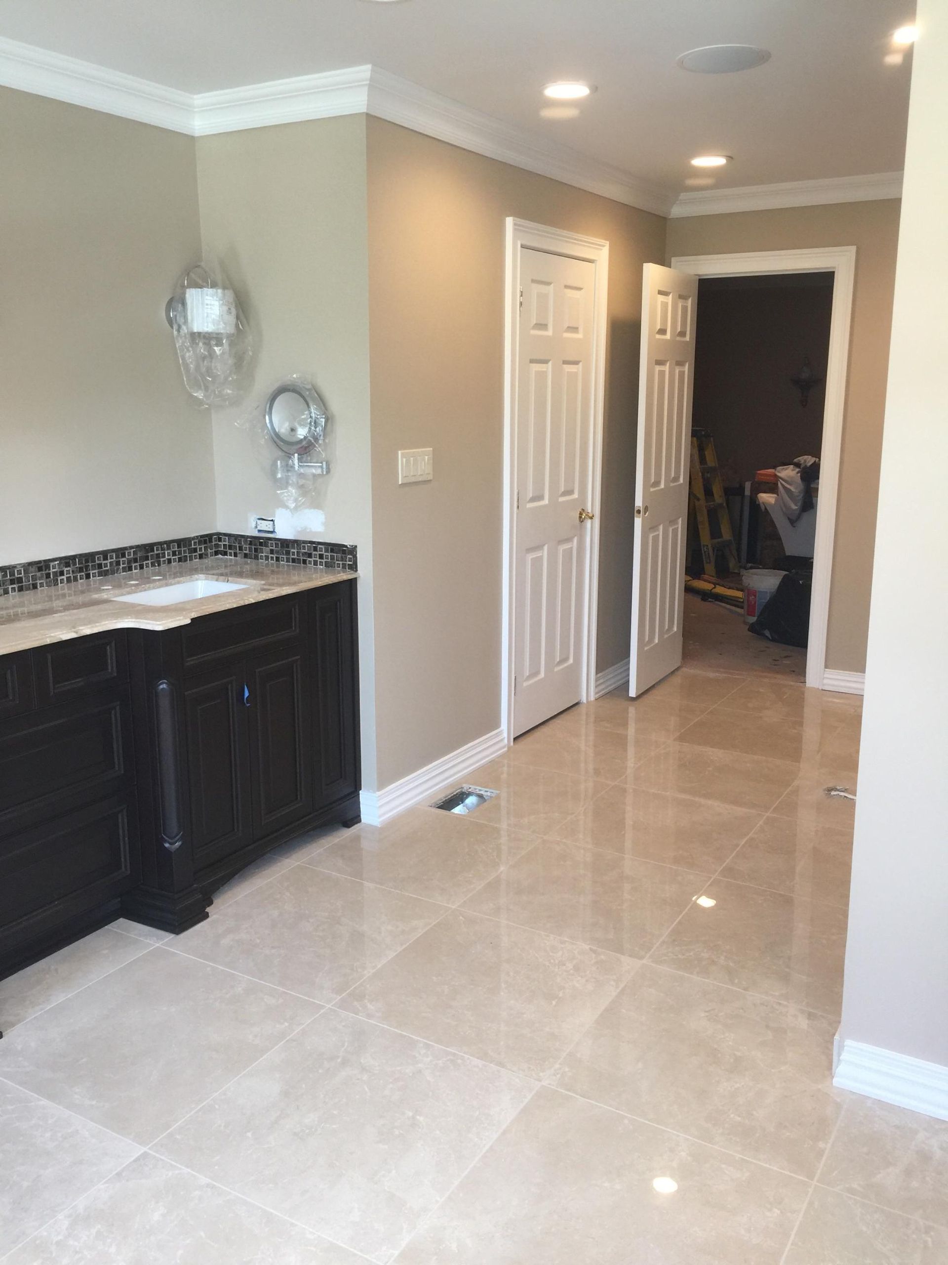 A bathroom with a sink and a mirror in it