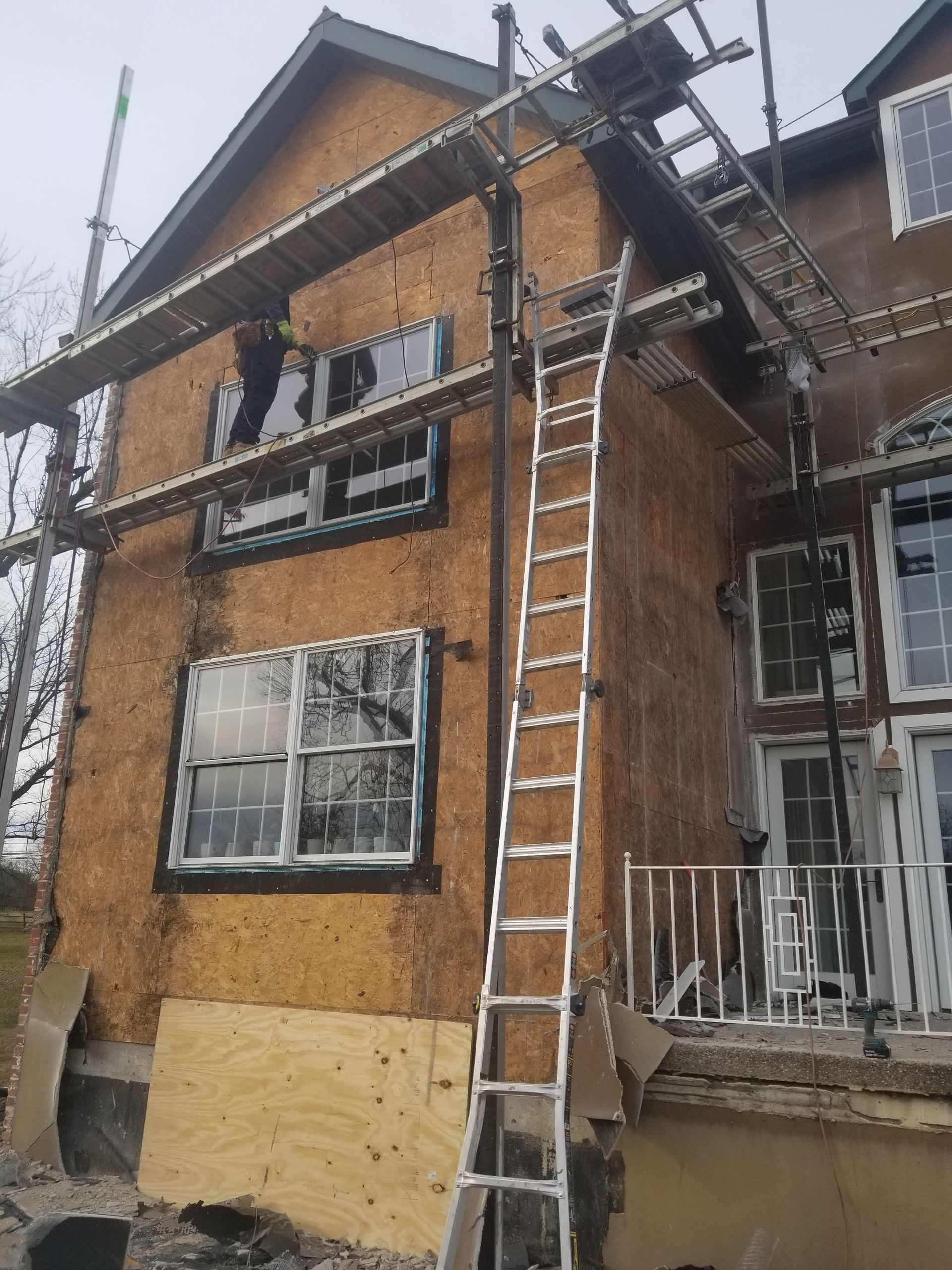 A house with a ladder on the side of it