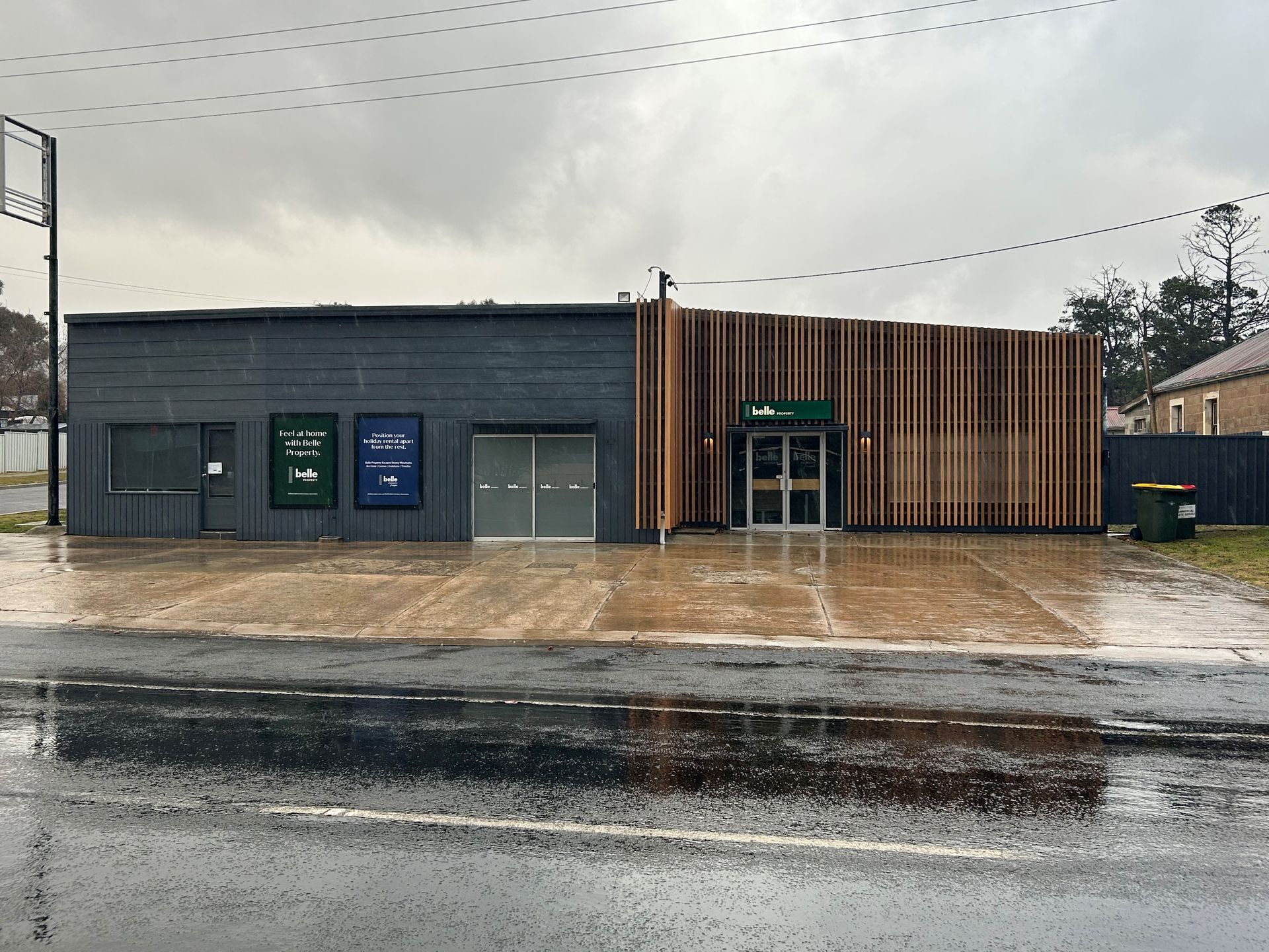 A man is standing in a room with a ladder and a circular saw.