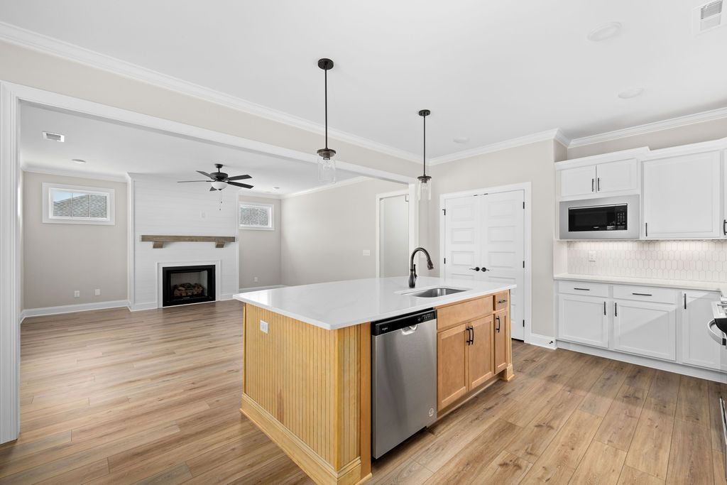 There is a large island in the middle of the kitchen.