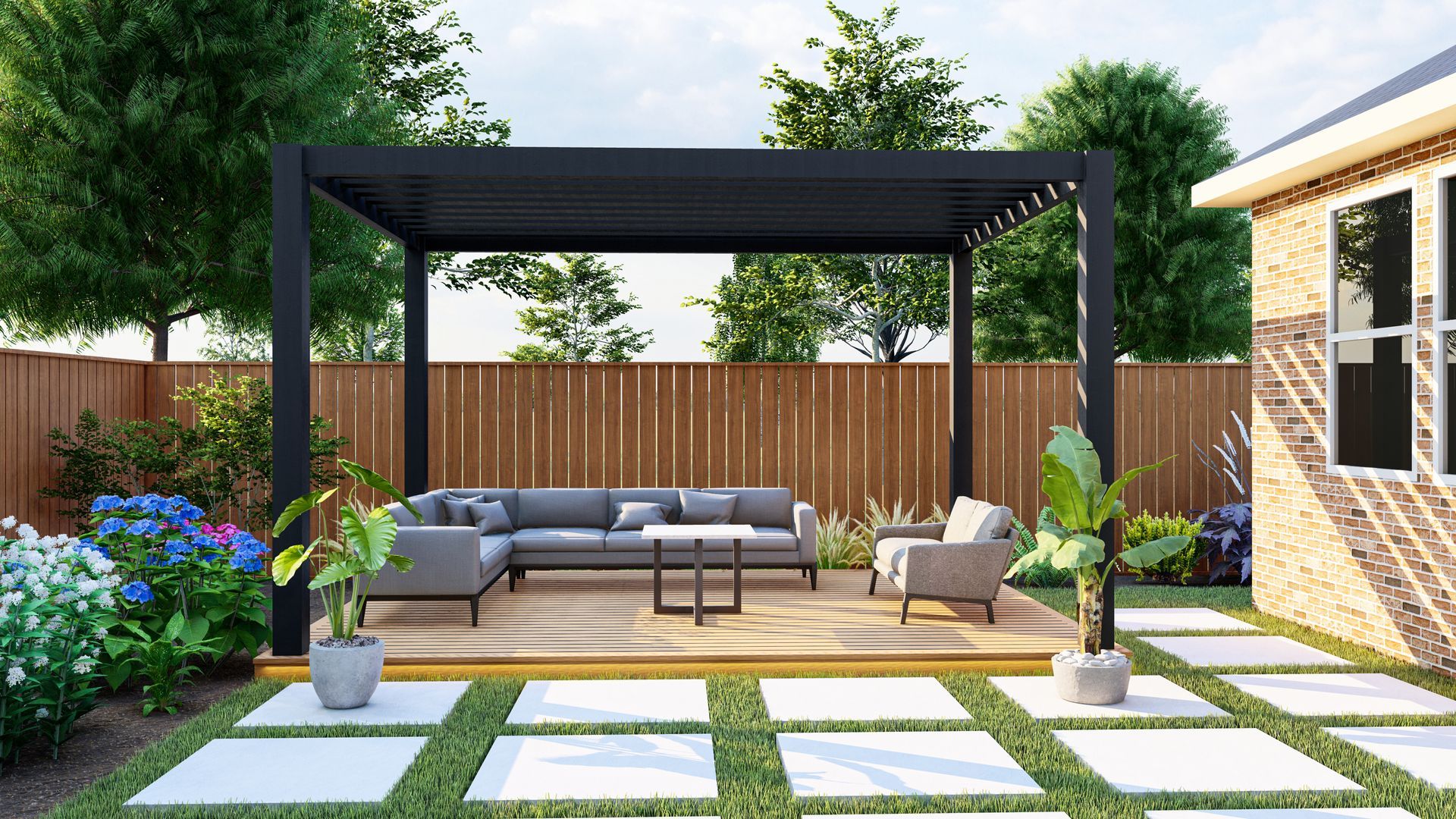 There is a pergola in the backyard with a couch and chairs underneath it.