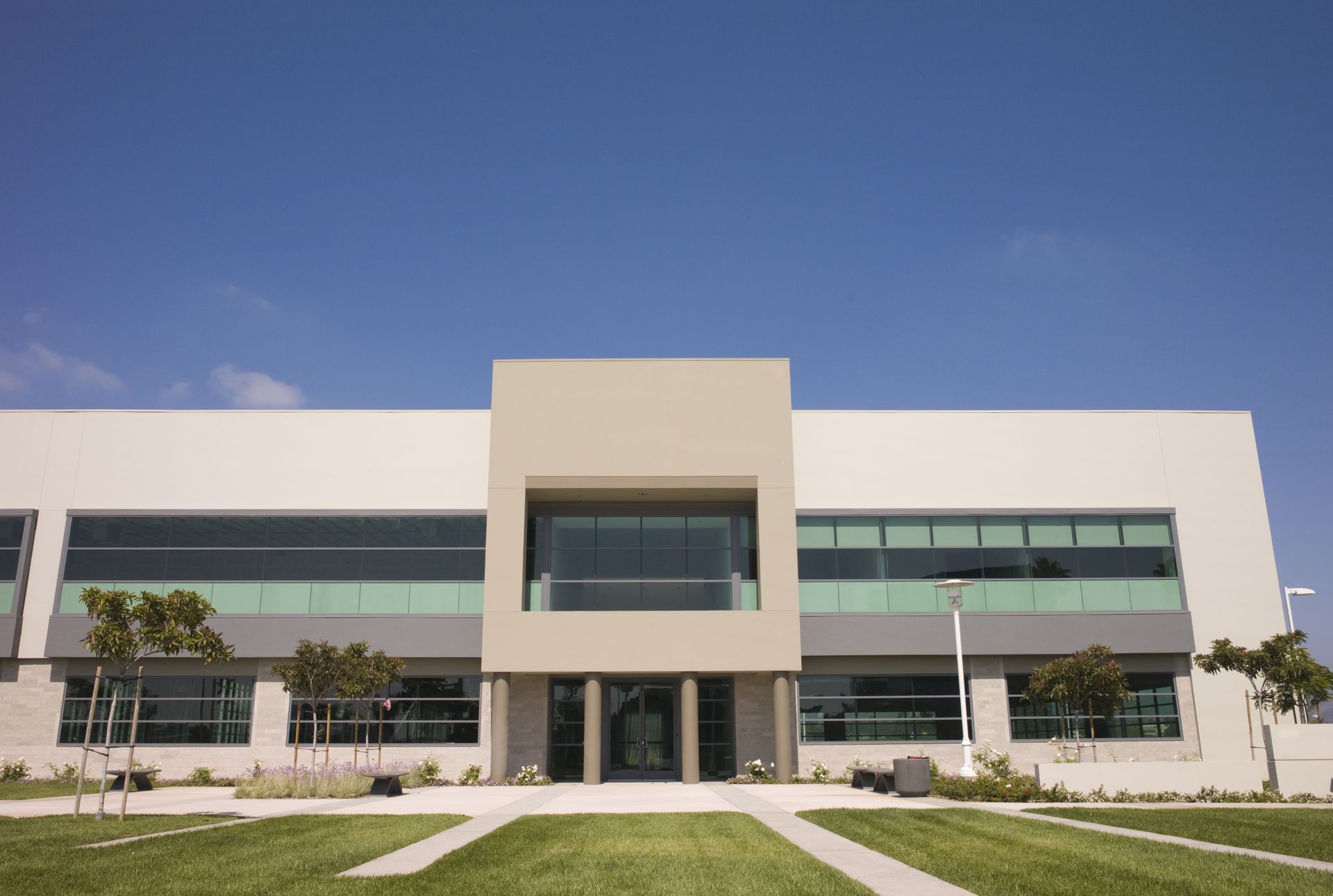 A large building with a blue sky in the background