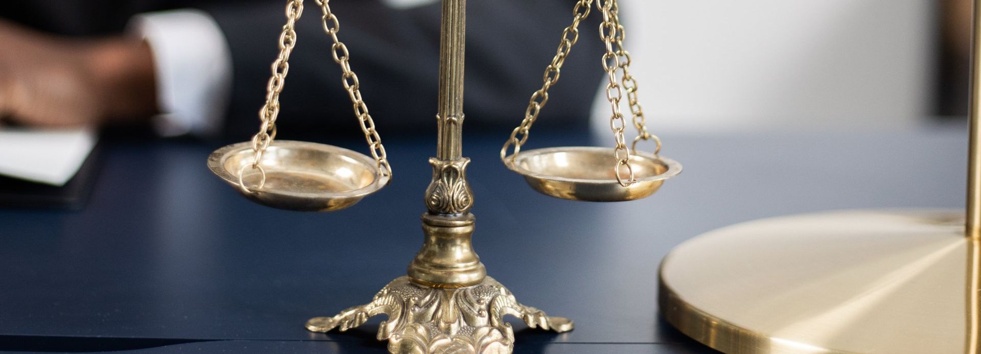 a close up of a scale of justice on a table .