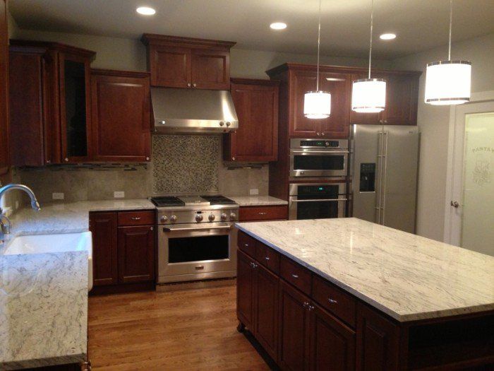 Home Building in WA — Wooden Cabinet With Granite on Top in Marysville, WA