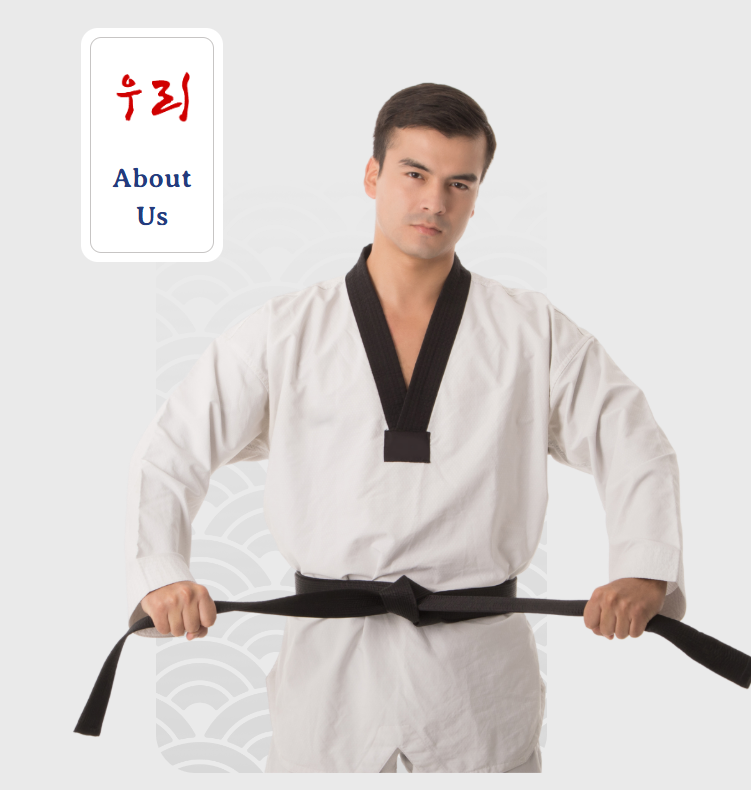 A man in a white karate uniform is holding a black belt
