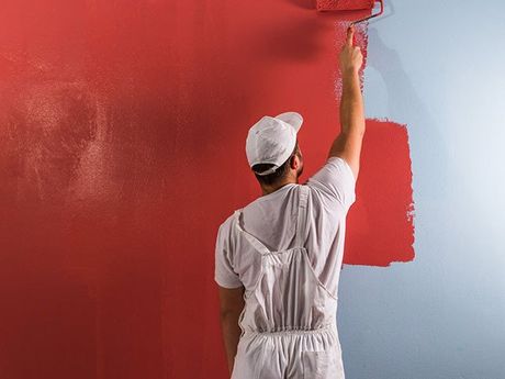 Man Painting Wall With Roller — Classic Coatings Australia In Maryborough QLD