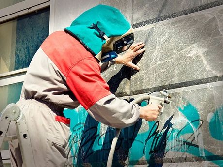 Cleaning Graffiti From A Building Wall — Classic Coatings Australia In Hervey Bay QLD