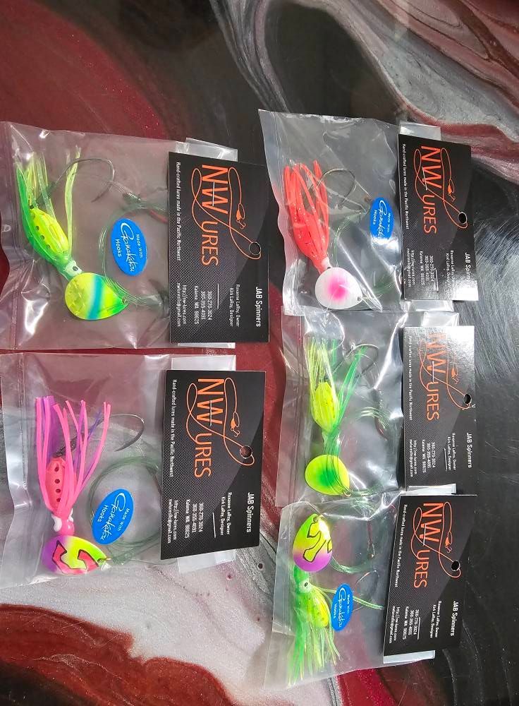 A bunch of fishing lures are sitting on a table