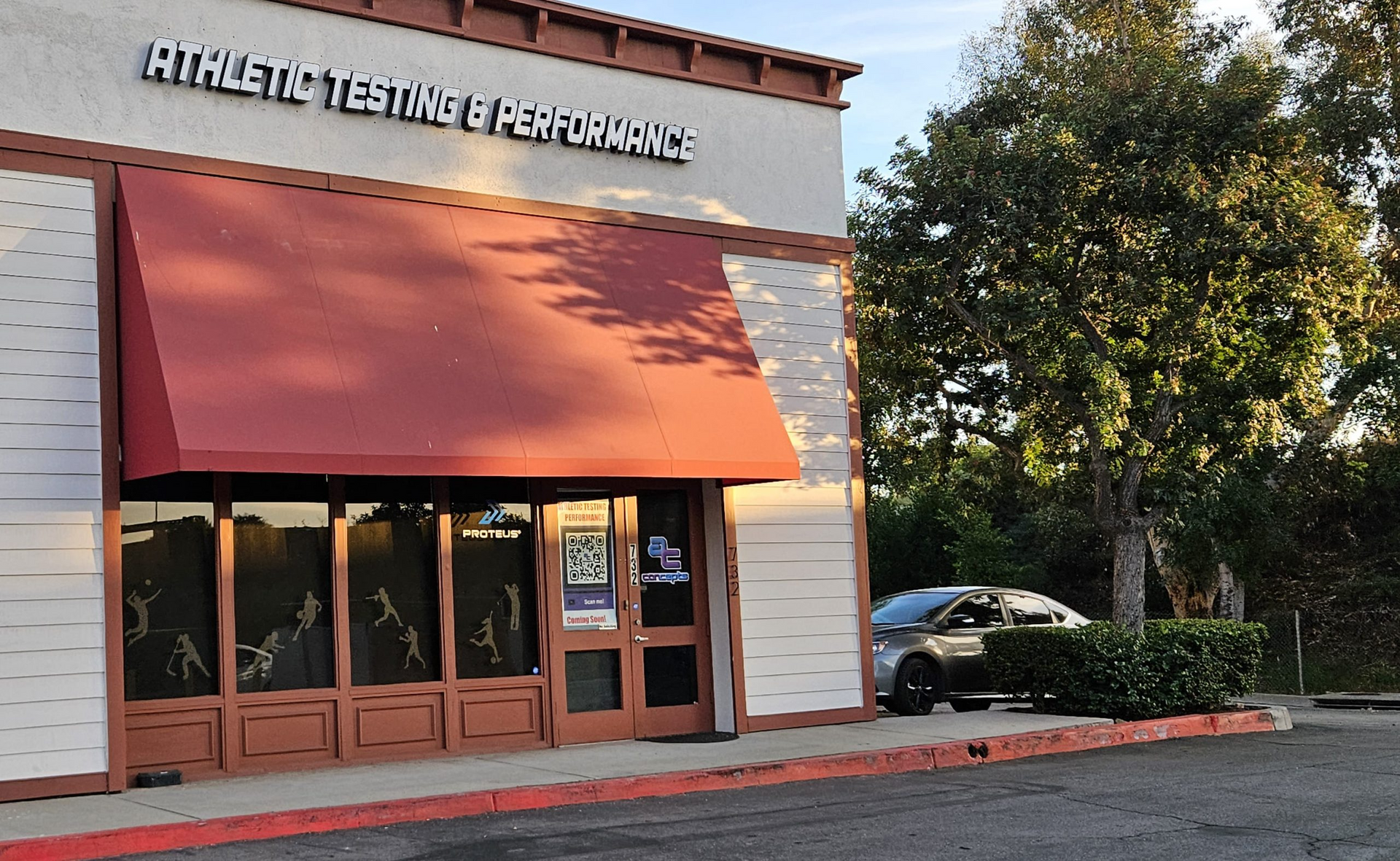 A building with a red awning that says athletic testing & performance