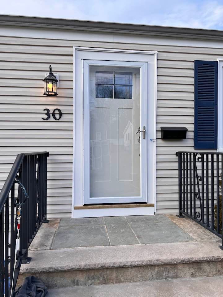 The front door of a house with the number 30 on it
