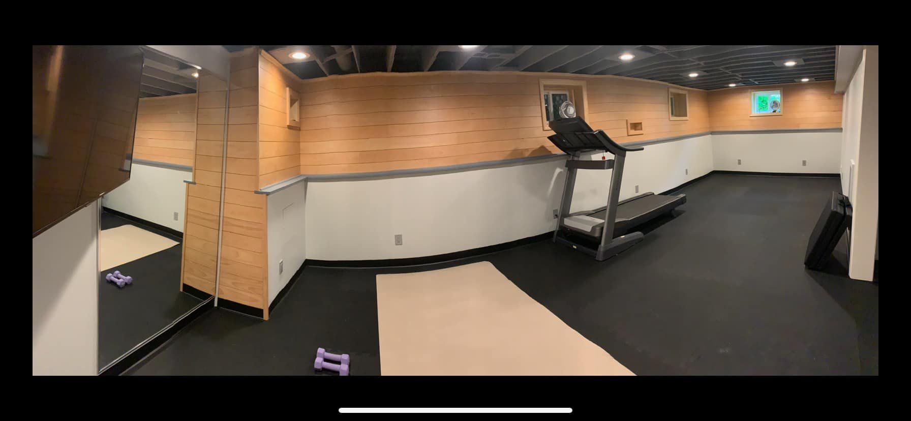 There is a treadmill in the middle of the room.