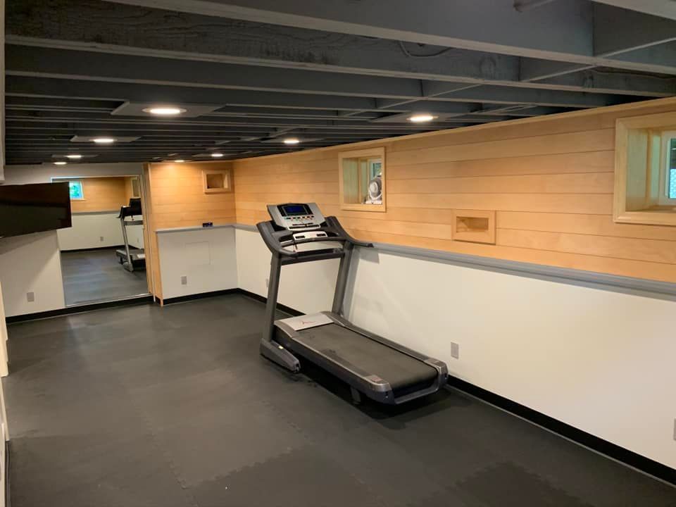 There is a treadmill in the middle of the room.