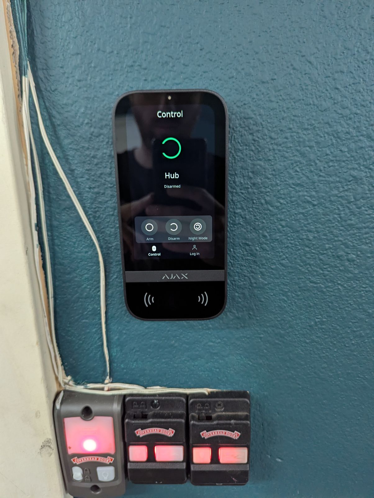 Ajax KeyPad TouchScreen wall-mounted by the entry during a South Sound home security installation