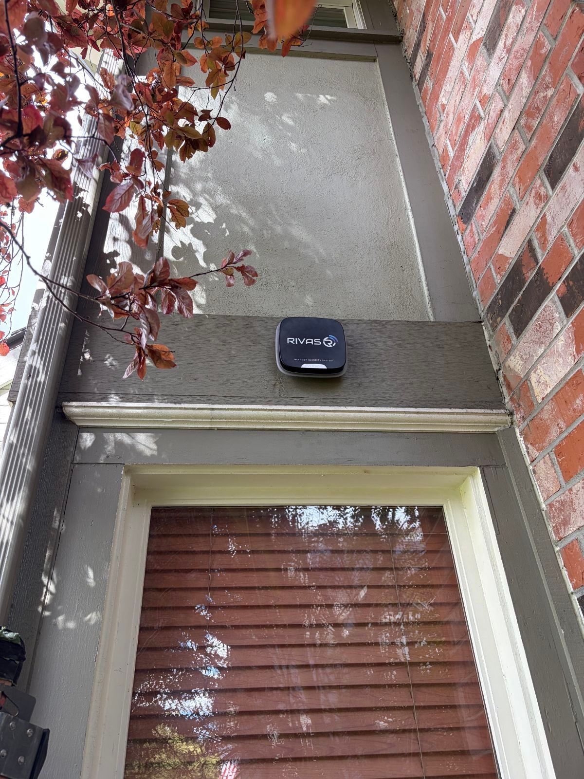Ajax StreetSiren DoubleDeck outdoor siren installed above an entryway on a Washington home by Rivas Technology Group