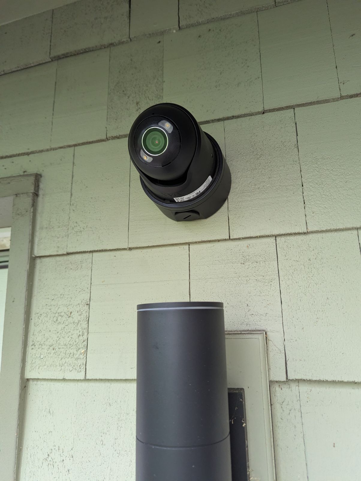Ajax TurretCam HL AI security camera mounted on an exterior wall during a South Sound home installation by Rivas Technology Group