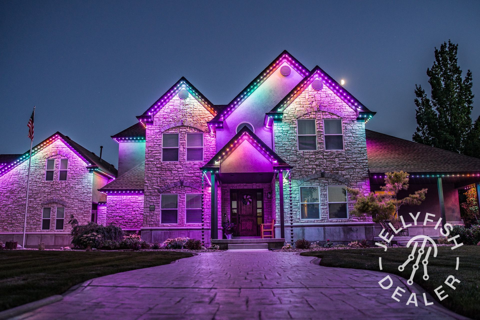Bonney Lake home featuring a custom-planned JellyFish permanent holiday lighting system with even spacing and trim-matched track. 