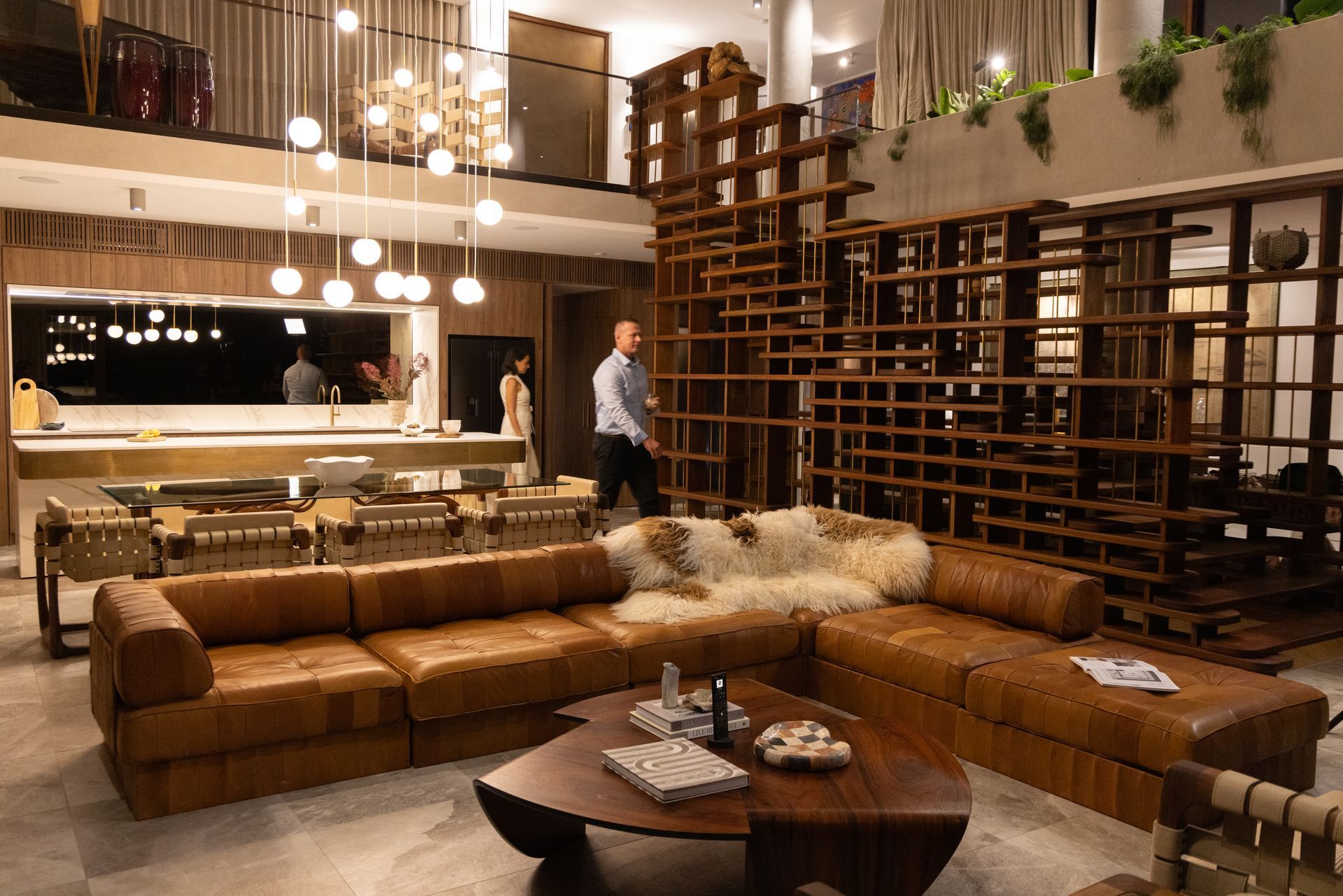 Modern luxury living room with integrated smart home lighting, open floor plan, and contemporary interior design.