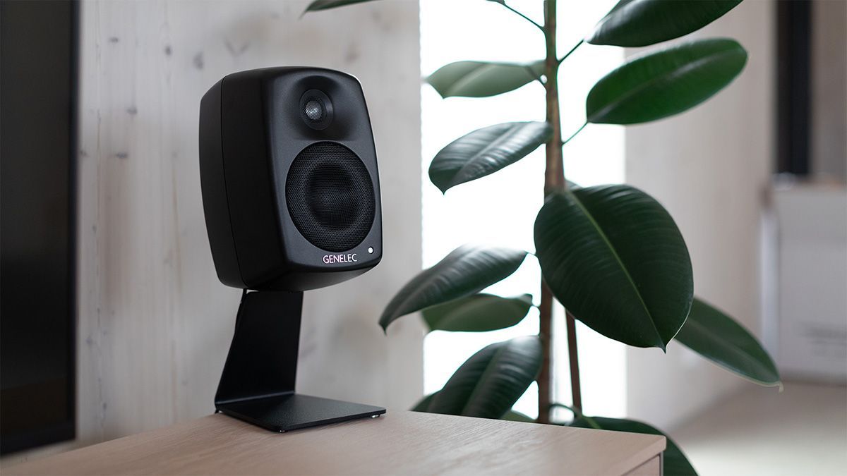 Genelec Smart IP black speaker on stand in modern living space