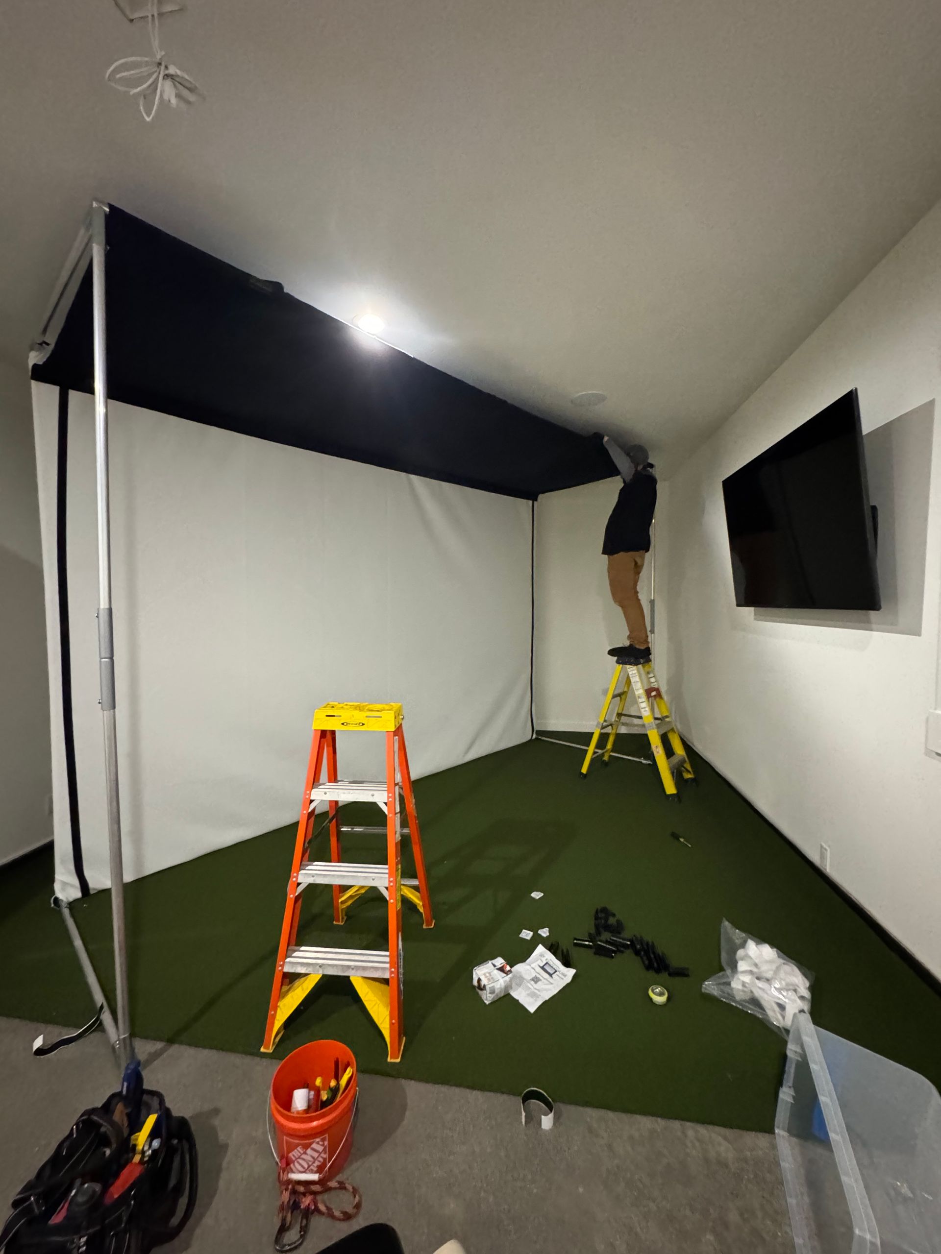 Golf simulator enclosure surround installation in progress South Sound WA