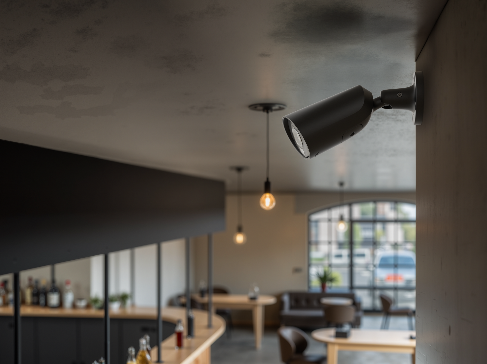 Modern indoor bullet security camera mounted in a smart home environment.