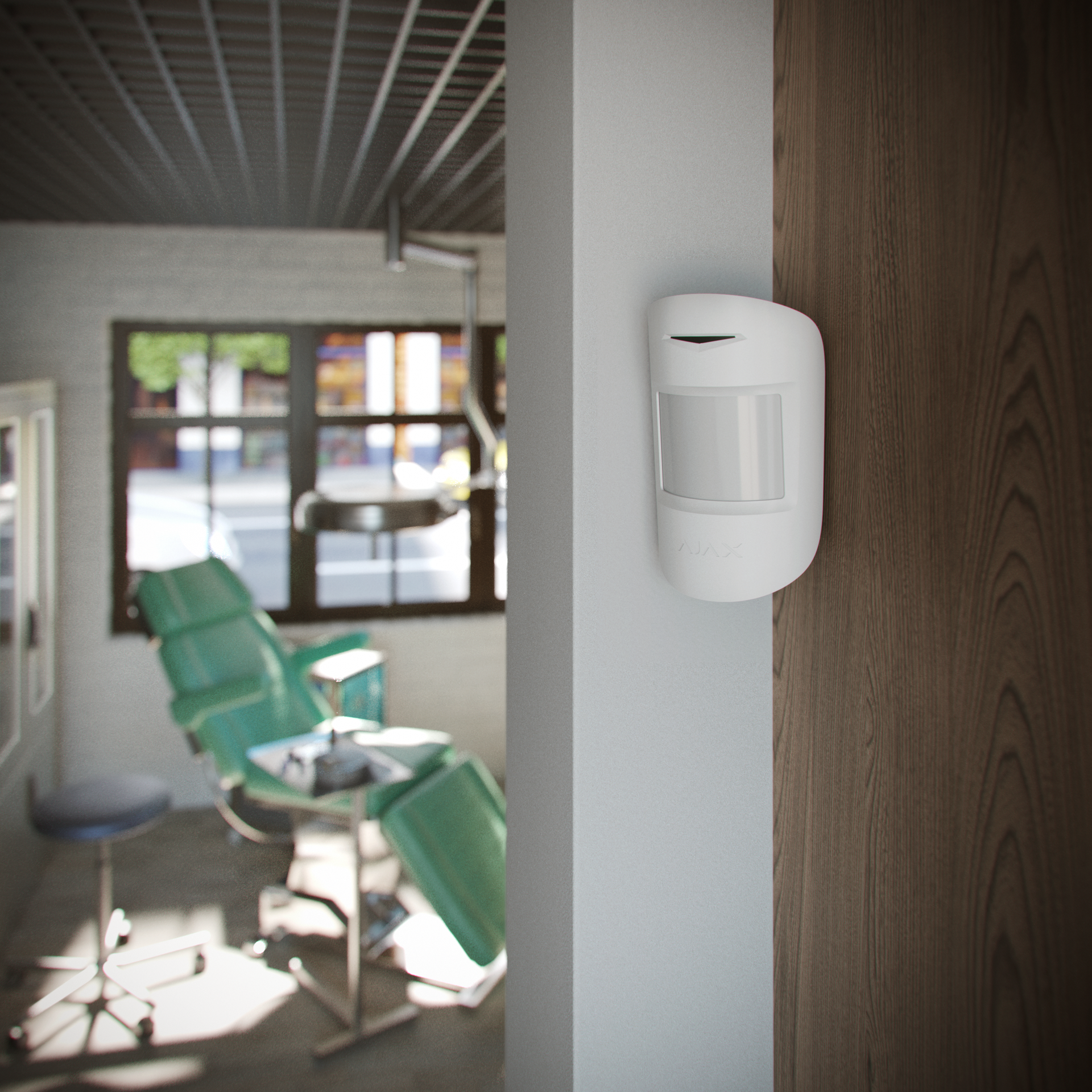 Ajax MotionProtect wireless security sensor blending discreetly into a clean white wall