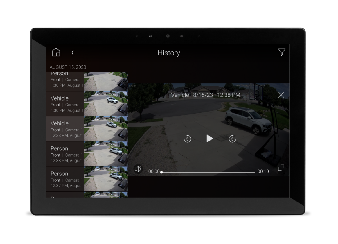 Touchscreen display showing recorded security camera footage with multiple video clips and timestamps.