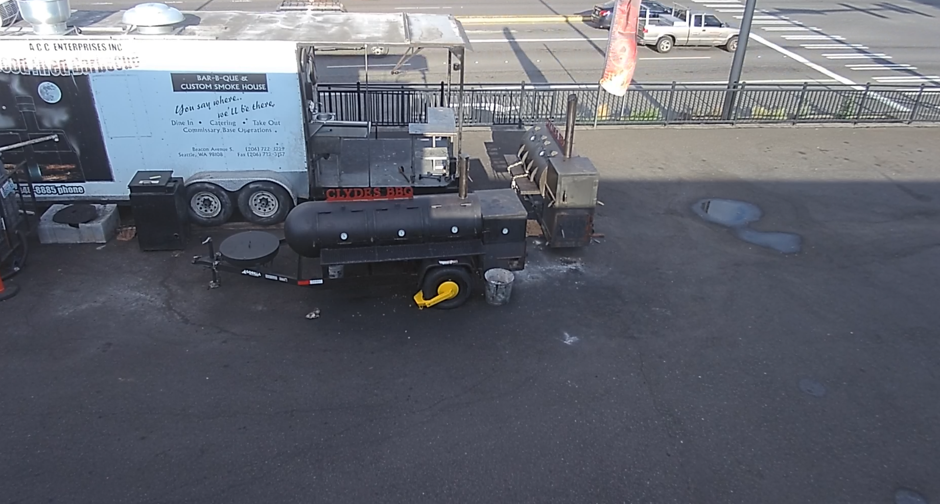 Surveillance camera view of smoker trailer and equipment yard at Clyde's BBQ