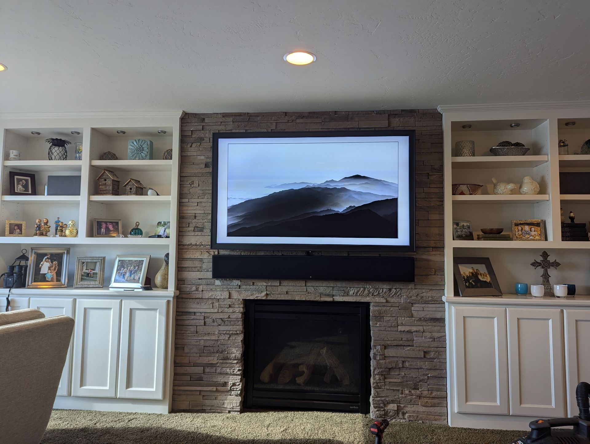 Sony 75 inch TV with custom Leon Speakers frame and matching frame soundbar installed by Rivas Technology Group