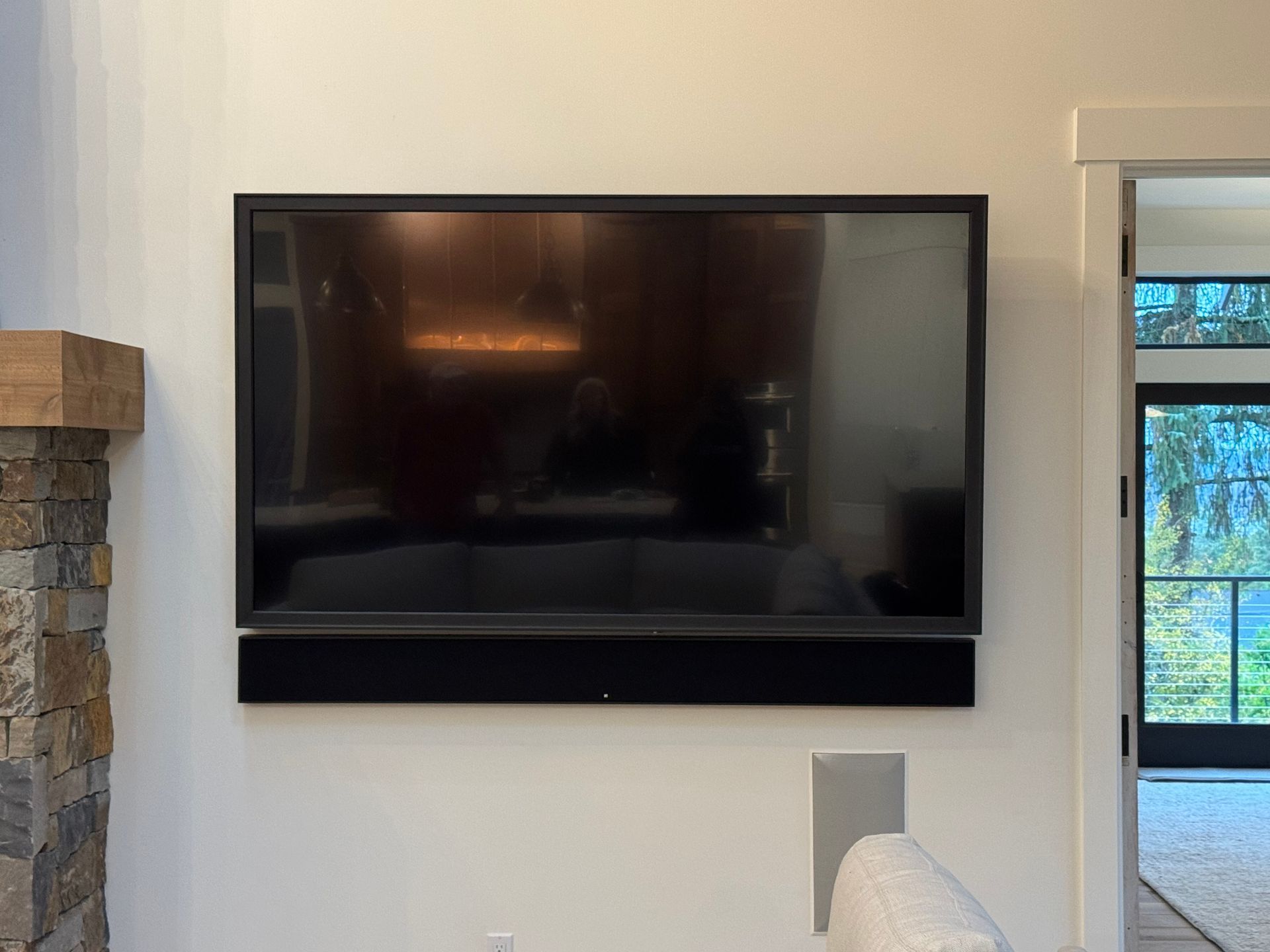 Sony 85 inch TV with custom Leon Speakers frame and matching frame soundbar