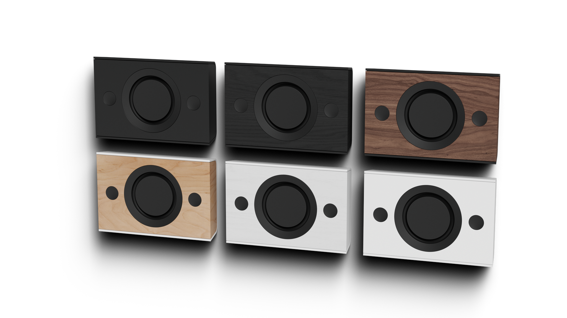 Collection of architectural in-wall and on-wall speakers in different finishes displayed against a dark background.