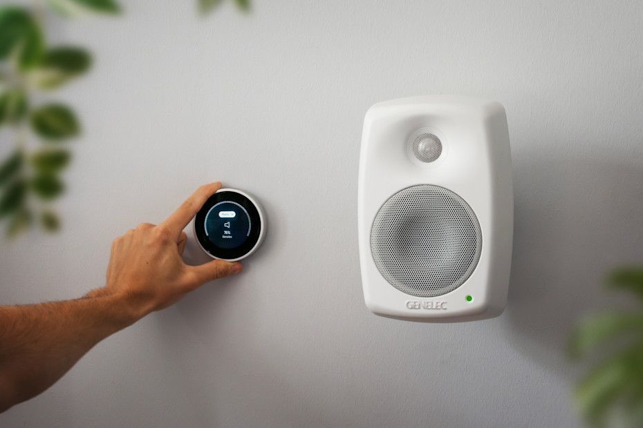 Tyba Turn2 smart controller adjusting volume beside Genelec Smart IP speaker