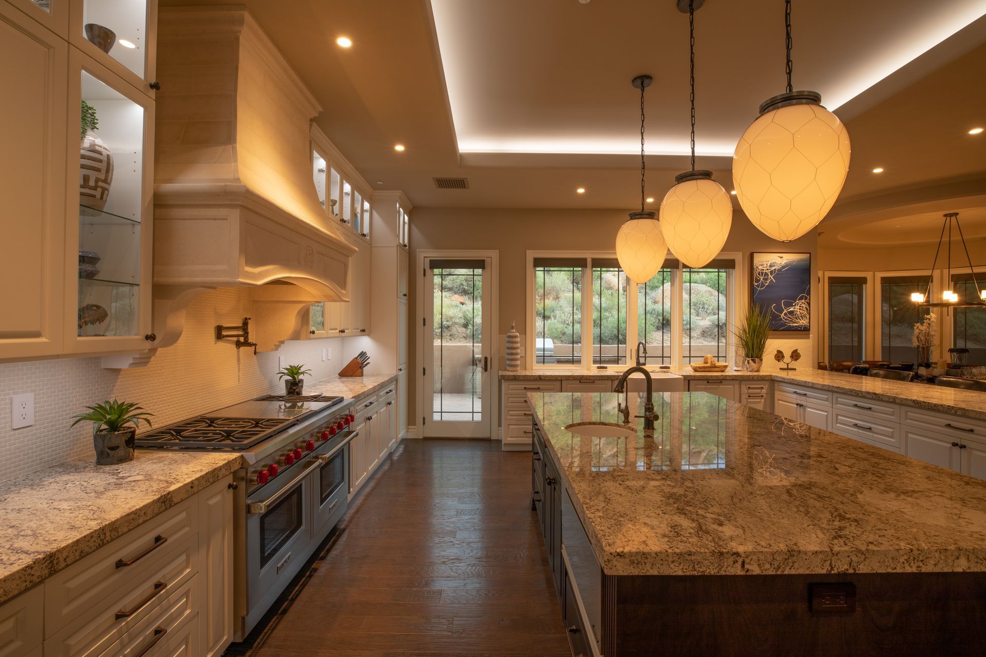 Elegant kitchen lighting with integrated Control4 lighting scenes and Colorbeam tunable fixtures.