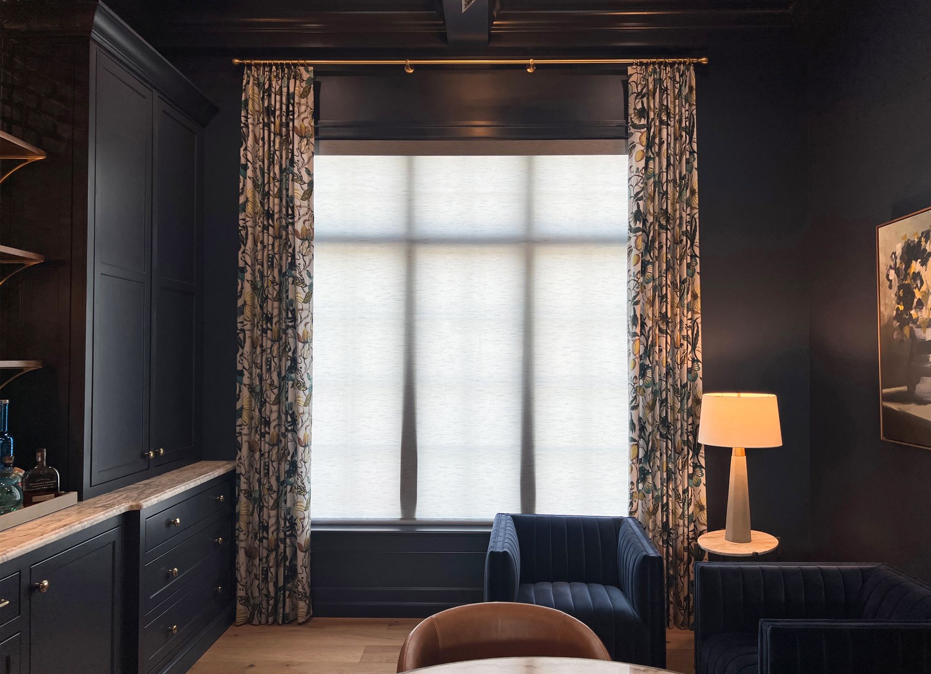 Motorized shades with elegant drapery in a luxury Puyallup living room