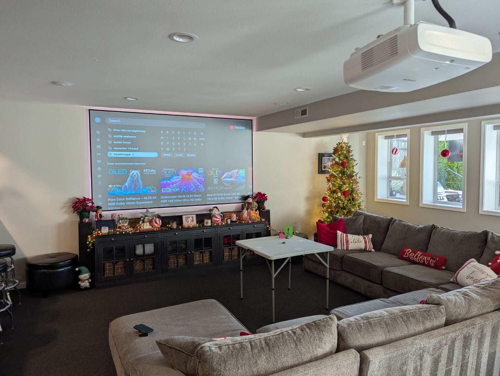 Home theater with ambient light rejecting screen performing in daylight