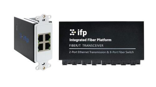 Modern open living room with large windows, natural light, and clean wireless access point installation.