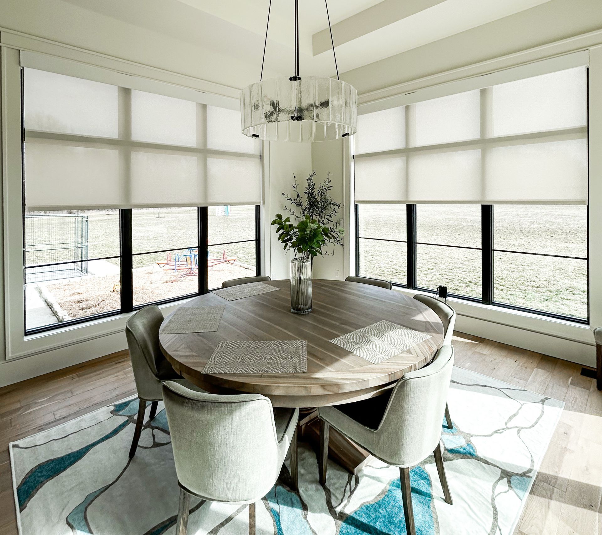 Motorized PowerShades installed in a Bonney Lake kitchen nook, providing soft filtered light and modern privacy control.