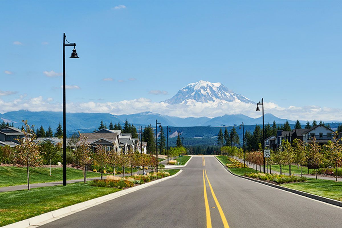 Scenic view of the Tehaleh community in Bonney Lake, Washington, with Mount Rainier in the background on a clear day.