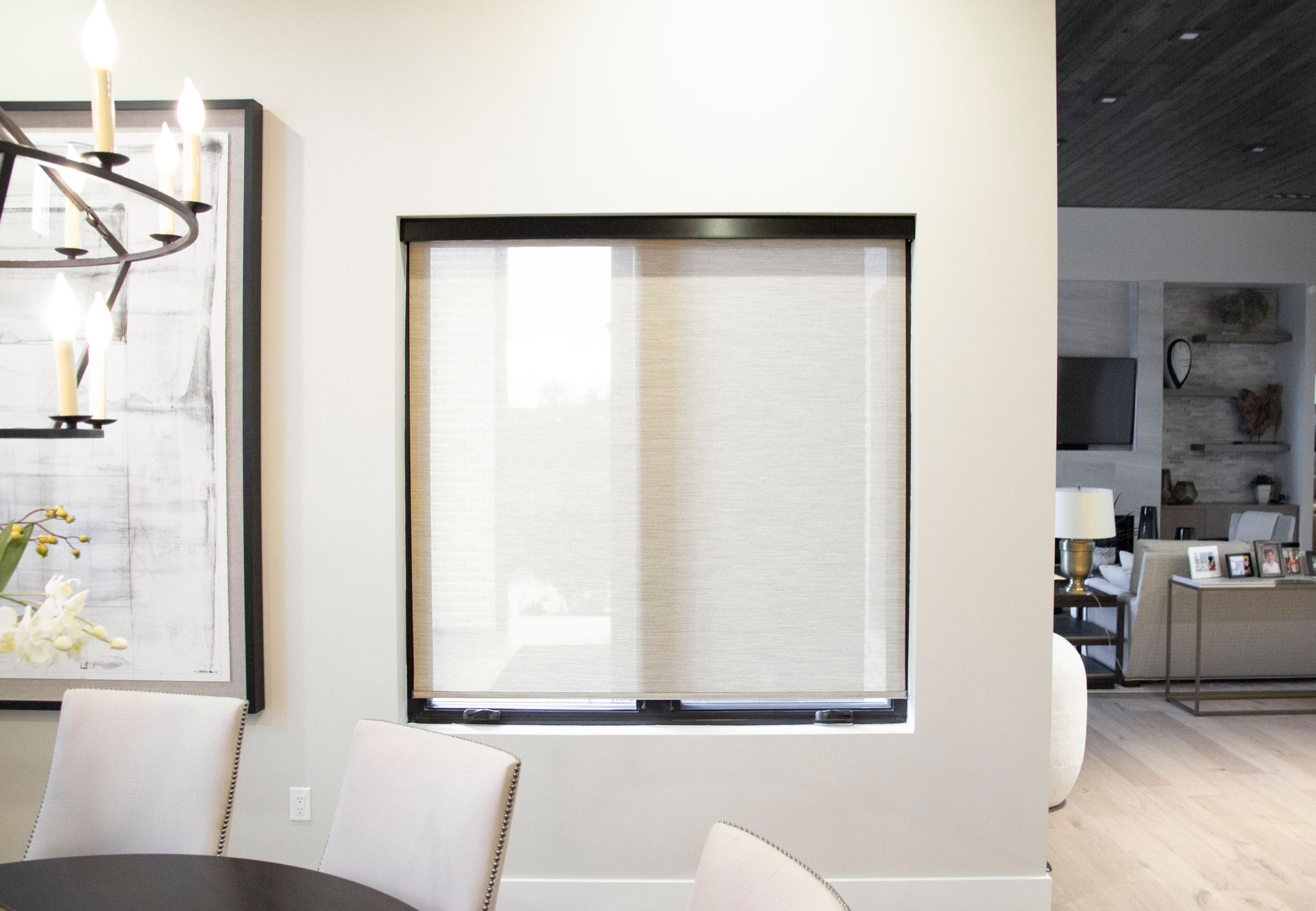 PowerShades motorized roller shade installed in a Bonney Lake dining room with soft natural light filtering through.